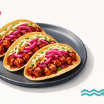 Tacos di tempeh BBQ con cipolla marinata, perfetti per un pasto gustoso e vegano. Ricetta ricca di sapore, ideale per gli amanti della cucina sana e creativa.